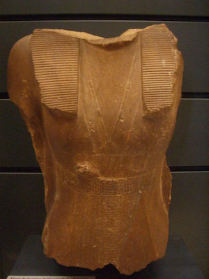 Statue of Sobekneferu wearing a sheath dress and a kilt, Louvre